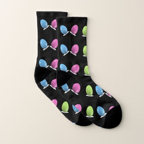 Colorful polka dots eggs on black socks