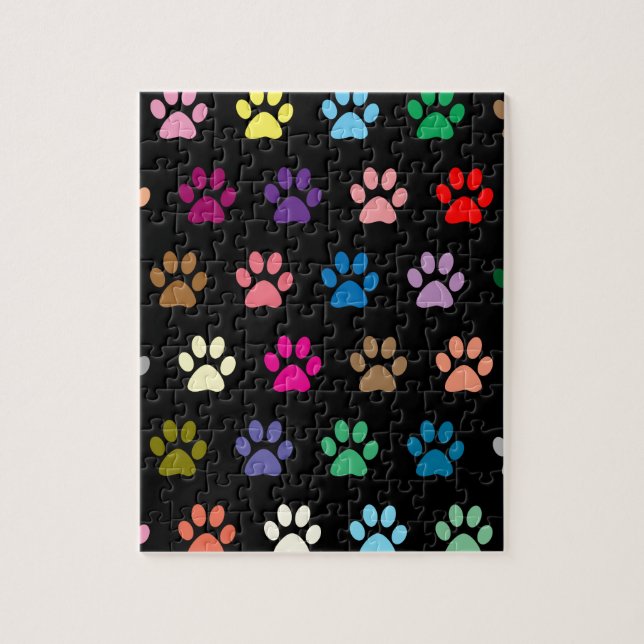 Colorful puppy paw prints on black jigsaw puzzle (Vertical)