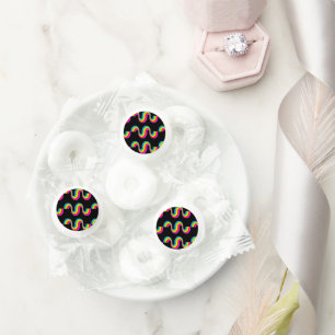 Colorful rainbow waves on black life saver® mints