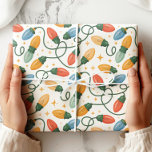 Colorful Retro Christmas Lights Wrapping Paper<br><div class="desc">Brighten up your holiday gifts with this cheerful retro Christmas lights wrapping paper! Featuring hand-drawn strings of colorful vintage bulbs in red, green, blue, and gold with sparkling star accents, this design adds a festive and nostalgic touch to your presents. Perfect for Christmas, holiday parties, Secret Santa, or any seasonal...</div>
