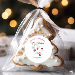Colorful Simple Merry Christmas Classic Round Sticker<br><div class="desc">The front of the ornament features a simple and elegant holiday theme. A thin branch adorned with various hanging ornaments,  including a reindeer,  a rainbow-colored ball,  patterned baubles,  a mushroom,  and a Santa figurine,  adds a whimsical and festive touch.</div>