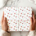 Colorful Simple Merry Christmas Wrapping Paper<br><div class="desc">The wrapping paper features a simple and elegant holiday theme. A thin branch adorned with various hanging ornaments,  including a reindeer,  a rainbow-colored ball,  patterned baubles,  a mushroom,  and a Santa figurine,  adds a whimsical and festive touch.</div>