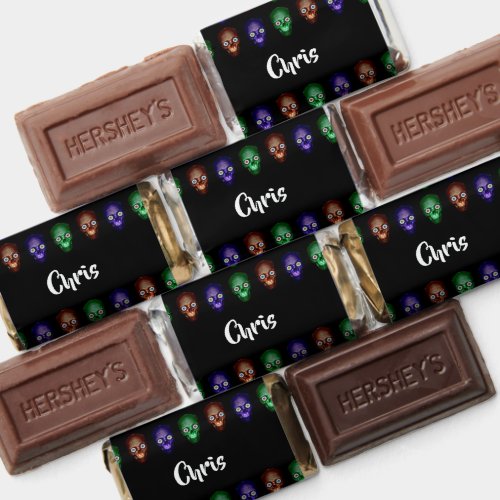 Colorful skull heads on black hershey's miniatures