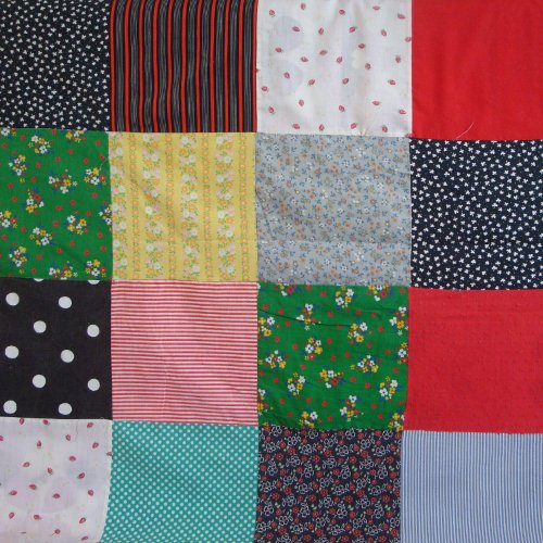 colorful squares of vintage cottagecore patchwork pouf