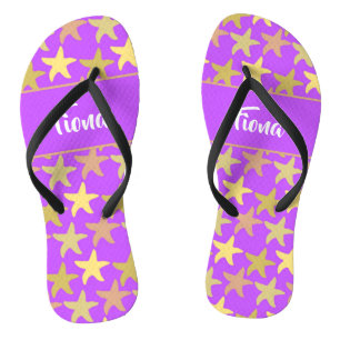 Colorful starfish on purple flip flops