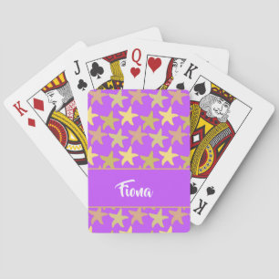 Colorful starfish on purple poker cards