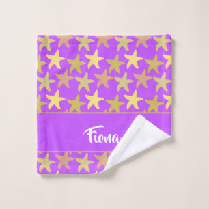 Colorful starfish on purple wash cloth