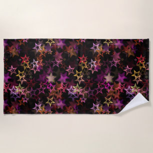 Colorful Stars Dance Whimsically Beach Towel