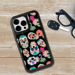 Colorful Sugar Skulls Pattern OtterBox iPhone 14 Pro Max Case<br><div class="desc">Bright images of sugar skulls make a colorful pattern on this colorful and unique phone case. There are several different skull images,  all individual in various colors,  and placed on a dramatic black background.</div>