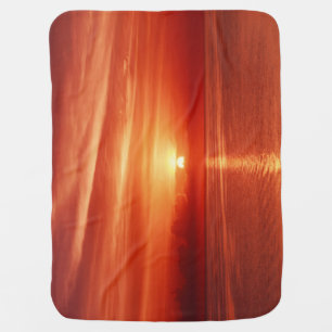 Colorful sunrise at sea, dramatic clouds. baby blanket