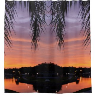Colorful sunset scene through the palm