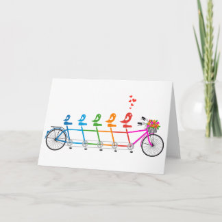 colorful tandem bicycle with cute birds family card