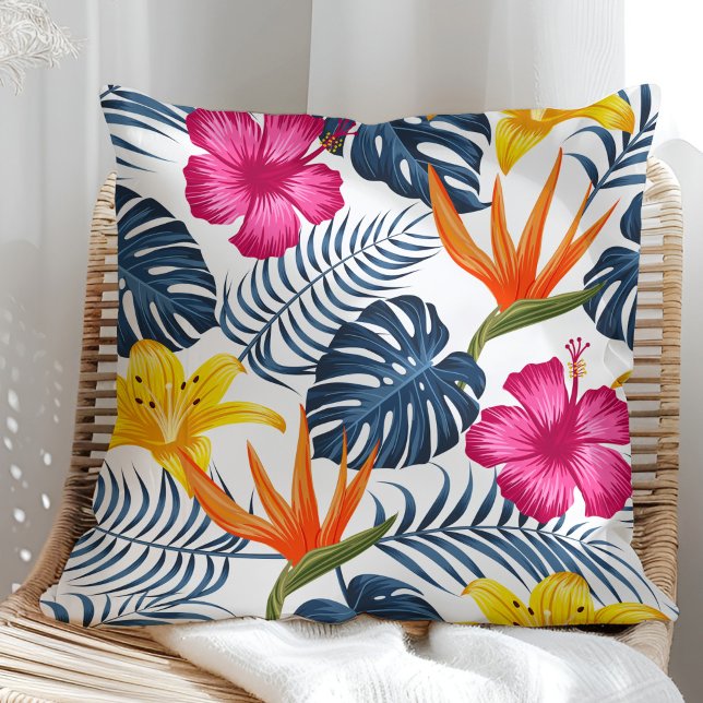Colorful tropical design on a white pillow (Colorful tropical design on a white pillow in a sunny rattan armchair.)