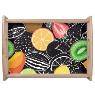 Colorful tropical fruits, black background. serving tray