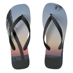 Colorful tropical sunset on flip flops