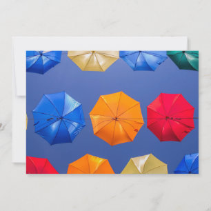Colorful umbrellas in the sky blue orange red invitation