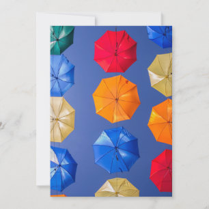 Colorful umbrellas in the sky blue orange red invitation