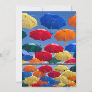 Colorful umbrellas in the sky blue orange red invitation