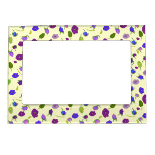 Colorful violets and green leaves on soft yellow magnetic frame