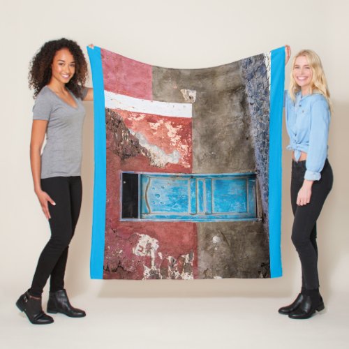 Colorful wall with blue door fleece blanket