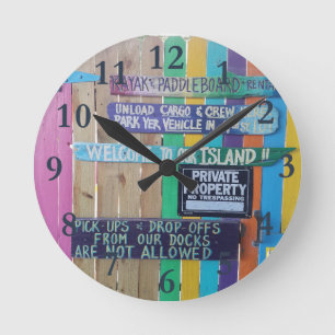 Colorful Welcome Island sign Carribean Round Clock