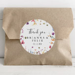 Colorful Wild Floral Thank You Wedding Favor Classic Round Sticker<br><div class="desc">This colorful wild floral thank you wedding favor classic round sticker is perfect for a rustic wedding. The design features a yellow, purple, white wild flowers with foliage in a rose and green watercolor background. Make the sticker labels your own by including your names, the event (if applicable), and the...</div>