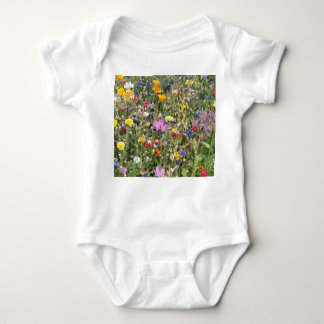 Colorful wildflower meadow, vibrant pattern. baby bodysuit