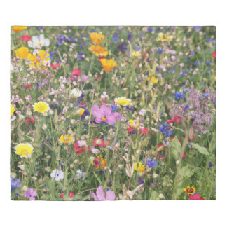 Colorful wildflower meadow, vibrant pattern. duvet cover