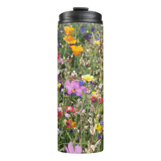 Colorful wildflower meadow, vibrant pattern. thermal tumbler