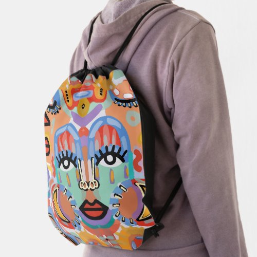 Colors Patterns and Overlapping Faces Drawstring Bag