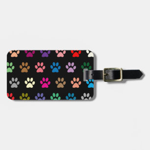 Colourful puppy paw prints on black luggage tag