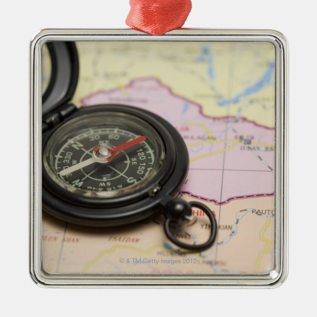 Compass on a map 2 metal ornament (Front)