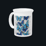 Composition of White and Blue Butterflies Beverage Pitcher<br><div class="desc">Vertical composition of realistic,  blue and white morpho butterflies on gray textured background. Morpho blue butterfly.</div>