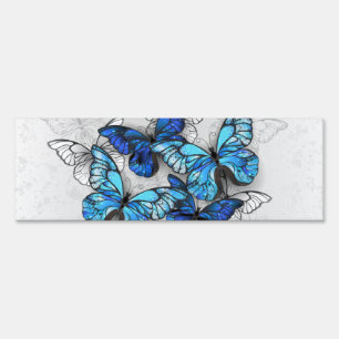 Composition of White and Blue Butterflies Sign