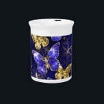 Composition with Sapphire Butterflies Beverage Pitcher<br><div class="desc">Composition of luxurious sapphire and gold jewelry butterflies on blue textured background.</div>