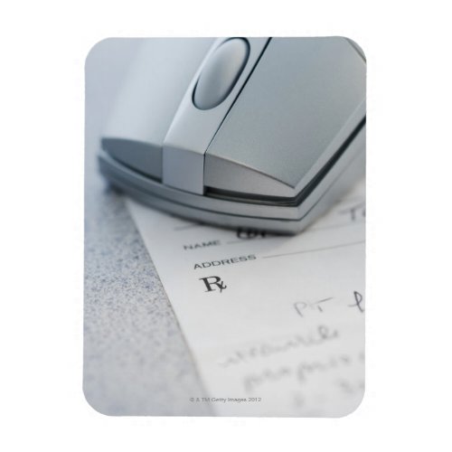 Computer mouse on written prescription magnet