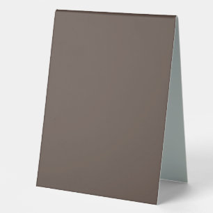 Confidently Against a Stylish Brown Wall Table Tent
