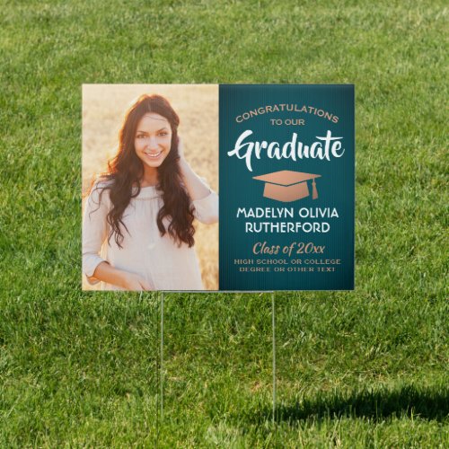 Congrats 2 Photo Teal and Copper Graduation Yard Sign - Add a personalized touch to a college or high school graduation celebration with a custom 2 photo teal, white, and faux copper yard sign. Pictures and all text are simple to customize. Simply place in lawn as a decoration or to welcome guests to a graduation party. Design features a blue-green ombre background, a faux foil mortar board cap, stylish modern typography, elegant script calligraphy, and two photos of the graduate, such as senior pictures or images from the commencement ceremony.  Please note that copper is printed color, not metallic foil. This outdoor party sign is an elegant way to celebrate the special day. Congratulations to the graduate!