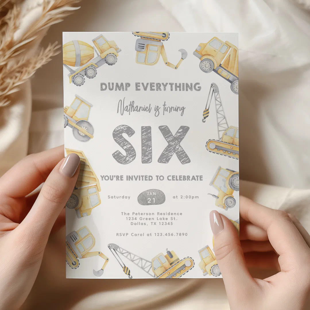 Nicely manicured hands are holding the invitation. There are numerous trucks and machinery printed around the card in yellow and black.. The main text is a charcoal grey with a pencil-drawn effect.
