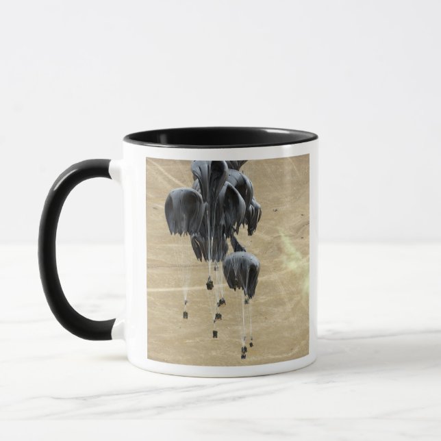 Container delivery system bundles parachute mug (Left)