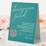 Contemporary Honeymoon Fund QR Code Teal Table Tent Sign<br><div class="desc">This collection features an elegant, modern, handwritten font to create key words and phrases. In this piece, the graphic typography overlays read "honeymoon fund" in the large header area and "with love & gratitude" before your names. Use the template fields to update your personal gratitude note and names. Feel free...</div>