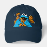 Cookie Monster Eating All the Cookies Hat<br><div class="desc">Satisfy your cravings for fun and cookies with this adorable navy blue baseball cap, featuring the one and only Cookie Monster! The cap showcases a vibrant illustration of Cookie Monster in his element, happily devouring a pile of chocolate chip cookies with crumbs flying everywhere. This classic and instantly recognizable design...</div>