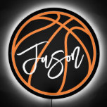 Cool basketball black orange any color room name LED sign<br><div class="desc">LED sign for kids featuring a basketball in black and orange and your kid's name in white. All colors are customizable in the design tool.</div>