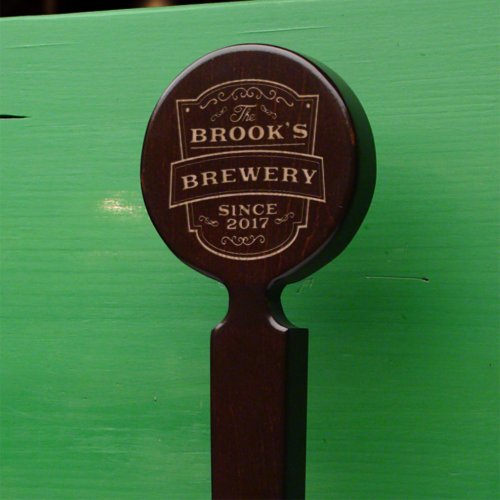 Cool Brewery Maple Hardwood Beer Tap Handle - Add a personal flair to your at home saloon with this vintage inspired handcrafted tap handle! Engraved with our Vintage Brewery design, they are personalized in house by our own engraver. Choose the name, year and custom text for the length of the handle for the ultimate gift for home bar owners. Hand made from the finest maple hardwood, and stained a deep dark brown. Personalized with any name and year you choose. Measures 13" x 3.5" x 0.75". Fits any universal kegerator or tap hardware. Please check all text entered above for misspellings; items will be printed EXACTLY as you submit them. Any fields left blank will not be personalized. 