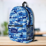 Cool Camo Shark Pattern Personalized Name Text Printed Backpack<br><div class="desc">Super fun backpack featuring a blue camouflage shark pattern and your custom name. Add an extra bonus line of text - phone number, team name, saying, etc. - or delete. Roomy enough for books, computer, sports gear and more - or use as a travel or sleepover bag too. Cool and...</div>
