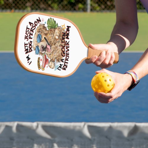 Cool dog with sunglasses sipping drink pickleball paddle