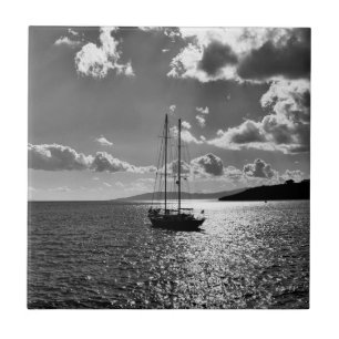 Cool dramatic sky over yacht on sea ceramic tile