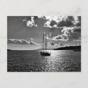 Cool dramatic sky over yacht on sea postcard