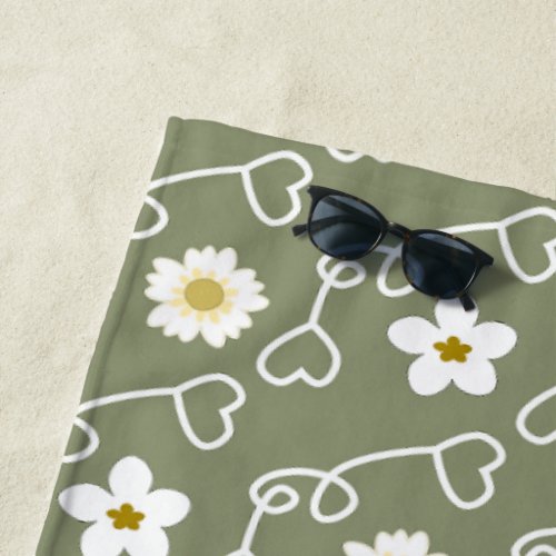 Cool hearts and white flowers on green background beach towel