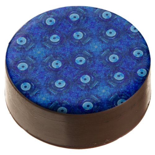 Cool modern digital art of blue evil eye pattern chocolate covered oreo